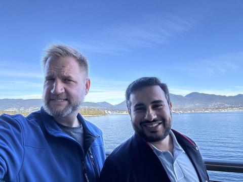 James and a friend with the harbour and North Shore mountains behind