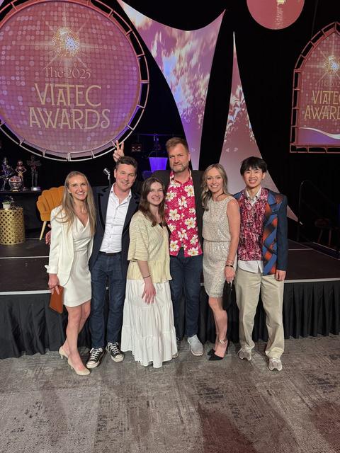 Six people posing on stage at the 2025 VIATEC Awards