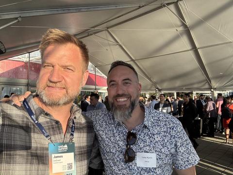 James and a friend under the tent at Web Summit Vancouver